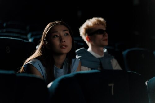 people watching a movie in the theater